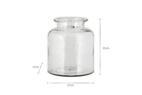 The image shows the nkuku Akra Recycled Glass Vase in clear. This cylindrical vase has a wide mouth, flared rim, and textured surface. Its dimensions are 21 cm high and 17 cm wide and deep. The background is plain white.