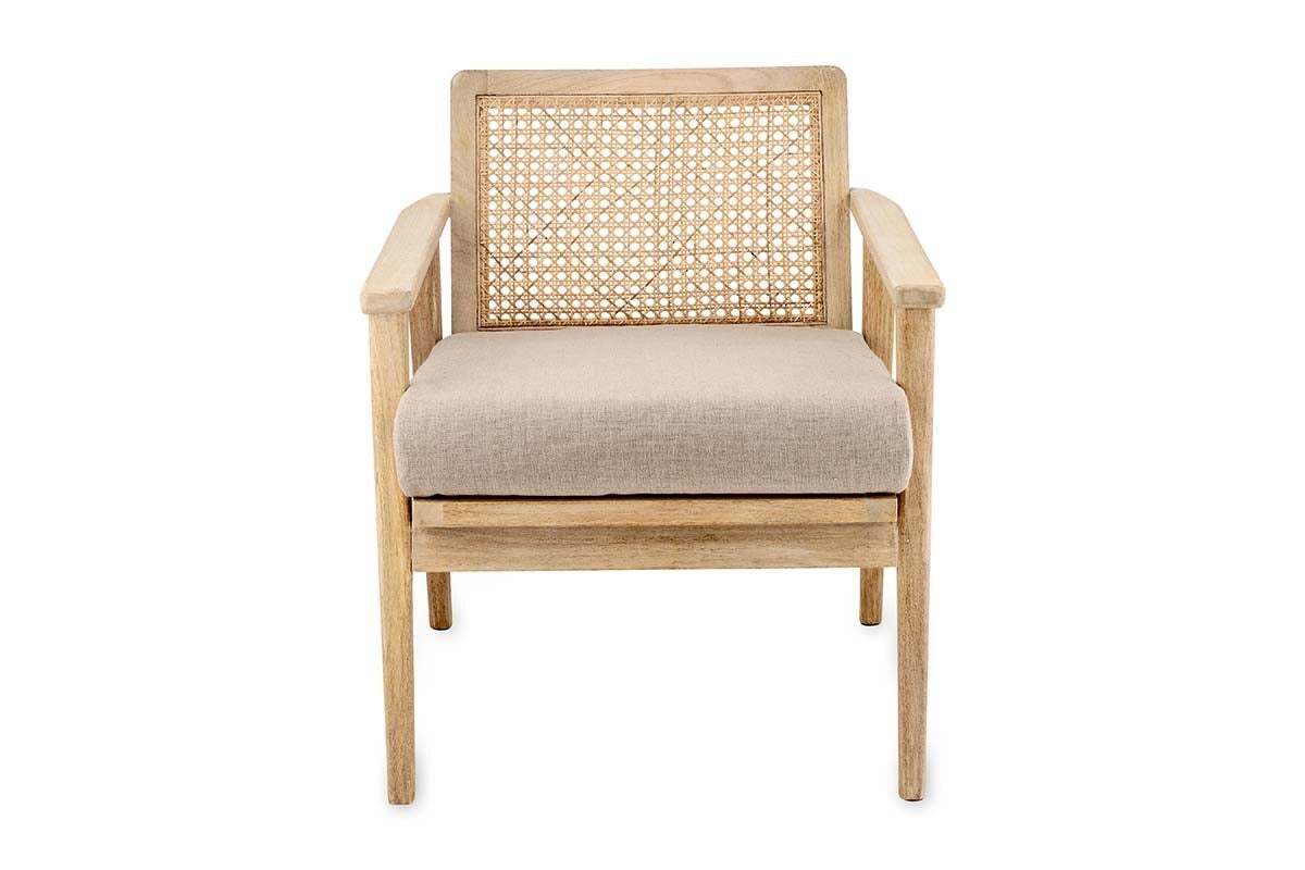 The Atri Mango Wood & Cane Occasional Chair by nkuku features a sustainable mango wood frame, woven cane backrest, beige upholstered cushion, and straight legs for a minimalist modern look. Shown on a plain white background.