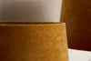 Close-up of nkukus Batakha Velvet & Linen Lampshade in Dark Ochre against a neutral background, showcasing its rich color and soft texture—an elegant lighting accent for any space.