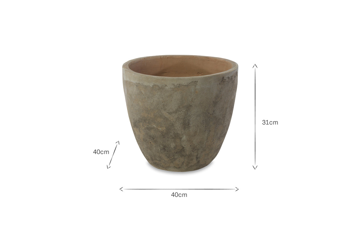 The nkuku Affiti Clay Planter - Medium is a round, grey concrete planter with a tapered base and textured surface, ideal for rustic garden decor. It measures 31 cm high and 40 cm in diameter, shown empty against a plain white background.