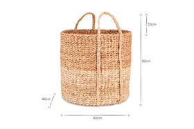 The nkuku Nkomi Basket is a handwoven natural storage basket with two handles and three beige bands, measuring 50cm tall by 40cm wide and deep, inspired by traditional Nkomi baskets.
