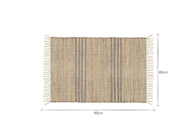 The Varli Jute & Cotton Doormat by nkuku is rectangular with beige and dark stripes, white fringe tassels on each short side, and measures 90 cm x 60 cm. This handcrafted indoor mat is shown on a white background.