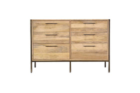 The Dasai Mango Wood Chest of Drawers by nkuku features six light mango wood drawers with slim handles, set in a dark metal frame and thin legs—a stylish and modern choice for any bedroom.