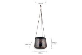 The Endo Reclaimed Iron Hanging Planter by nkuku features a round base, three brown suspension cords, and a weathered finish. Ideal for indoor plants, it measures 18.5cm W x 18.6cm H x 14.5cm D and is crafted from reclaimed iron.