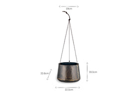 The Endo Reclaimed Iron Hanging Planter by nkuku features a dark metallic finish and gently tapered cylindrical shape. Ideal for indoor plants, it hangs on three black cords. Dimensions: 19cm top, 22.5cm base, 16.5cm pot height, 22.8cm cord.