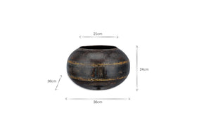 The nkuku Endo Reclaimed Iron Globe Planter is shown in distressed black with gold bands, featuring a wide body, narrow opening, and measures 36cm wide by 24cm tall; arrows indicate the dimensions. Crafted from reclaimed iron.