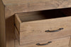 A close-up shows the nkuku Iya Reclaimed Wood Chest of Drawers (Small, Natural) with one top drawer partially open and another closed. Metal handles and a natural wood finish bring rustic charm to this unique piece.