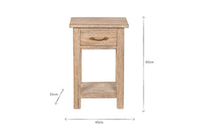 The Ibo Reclaimed Wood Bedside Table - Natural by nkuku is a rustic bedside table crafted from reclaimed wood, featuring one drawer with a dark metal pull, an open shelf below, and measures 60cm H x 40cm W x 35cm D.