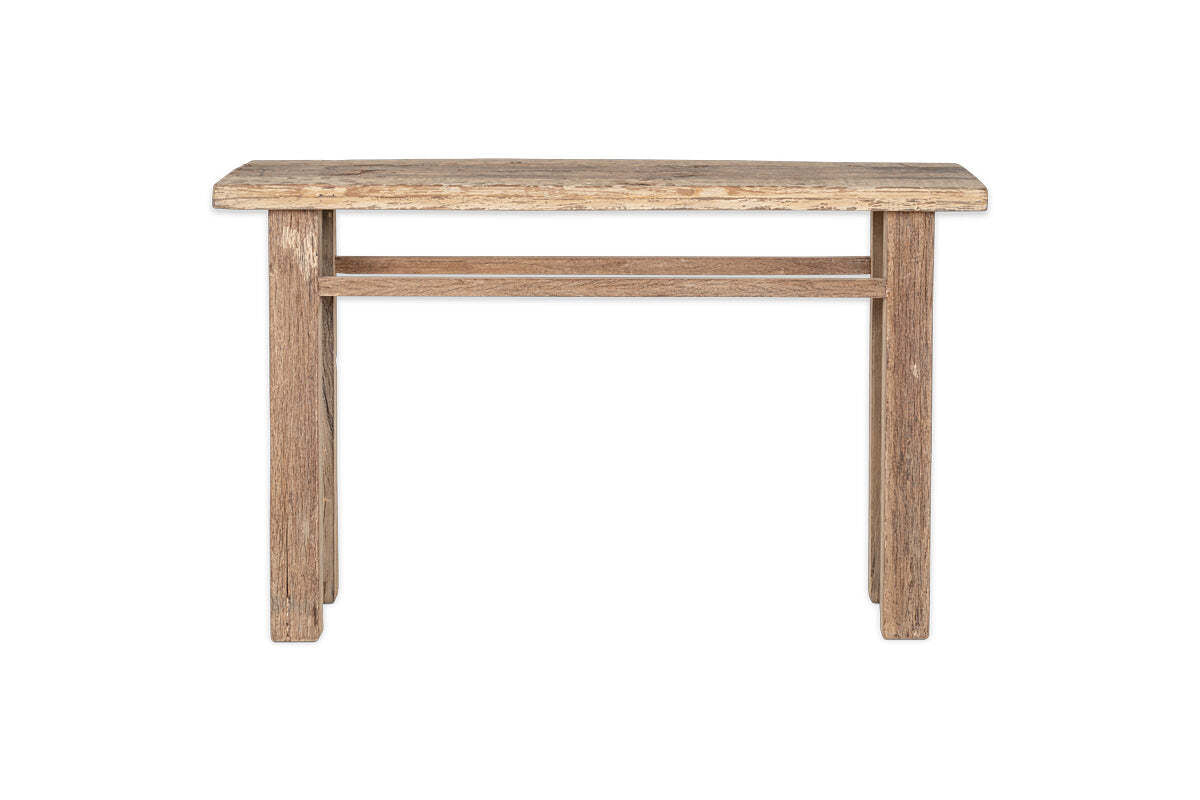 The nkuku Ibo Reclaimed Wood Console Table - Natural features a simple rectangular design with wooden panels, four straight legs, and a support bar, showcasing rustic charm and minimalism against a white backdrop.