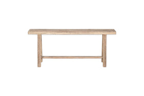 The nkuku Ibo Reclaimed Wood Long Bench - Natural has a rectangular seat, straight legs, and a support bar, all in a rustic natural finish. It’s shown on a plain white background for a clean, timeless look.