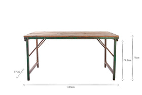 The Ishan Reclaimed Folding Dining & Coffee Table by nkuku is shown against a white background. This rustic rectangular wooden table with metal legs measures 153 cm long, 77 cm high, and has a tabletop thickness of 2.5 cm; measurement arrows are labeled.