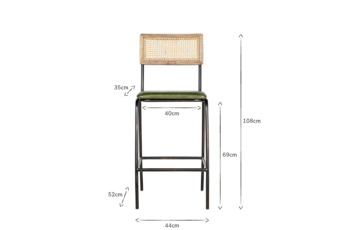 Front view of the Iswa Leather & Cane Counter Chair by nkuku, showcasing a woven cane back, rich green leather seat, and black metal frame. Dimensions: 108cm H, 44cm W, 40cm seat W, 35cm backrest H, 69cm seat H, 52cm leg H.