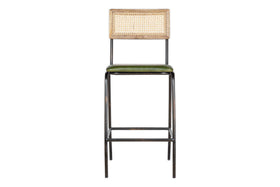 The Iswa Leather & Cane Counter Chair by nkuku features a distressed metal frame, rich green leather seat, and stylish woven cane back for added comfort.