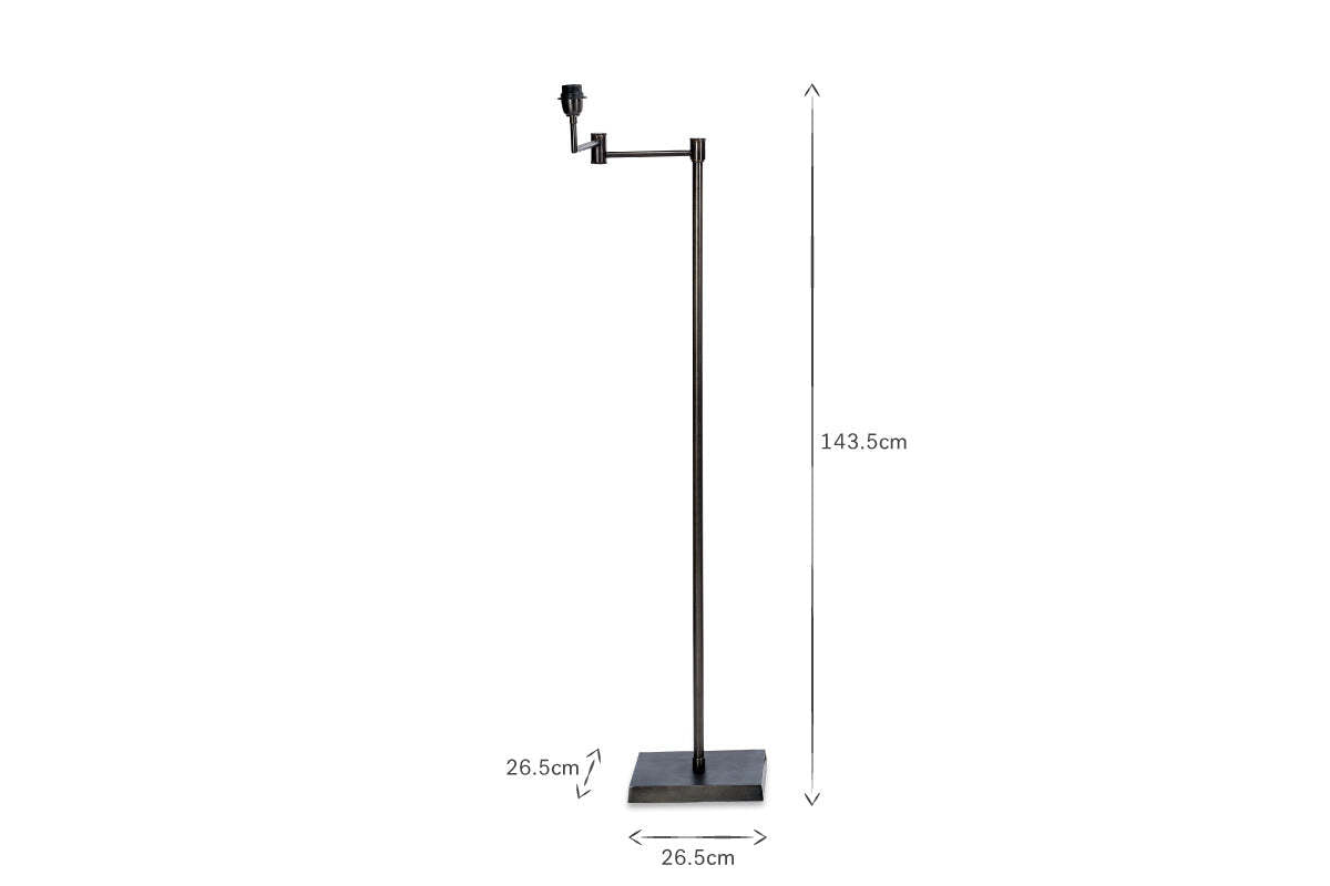 The Kara Iron Floor Lamp by nkuku showcases a slender, minimal design with a bronze finish and rectangular base. Standing 143.5 cm tall, it's photographed on a white background to highlight its modern elegance.