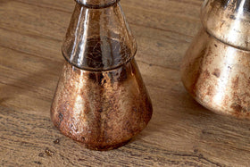 The Konara Glass Tree by nkuku features a gold crackle finish, creating a striking accent piece. Its metallic sheen and unique texture make it perfect for adding festive charm to any space or table setting.