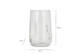 The Kotri Recycled Glass Organic Shape Vase by nkuku is a clear, cylindrical vase with subtle vertical ripples, standing upright on a white background. It measures 29 cm in height and 18 cm in width, with arrows indicating its dimensions.