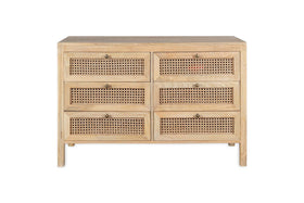 The nkuku Kanz Mango Wood Chest Of Drawers - Natural features six compartments, woven cane-front drawers, and round brass knobs. Made from light solid mango wood, it is shown against a white background.