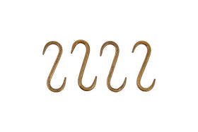 The nkuku Laila Iron S-Hooks in brass, sold as a set of 4, feature a smooth, rounded form and traditional design. Evenly spaced in a row on a white background, they’re ideal for use on iron hanging rails.