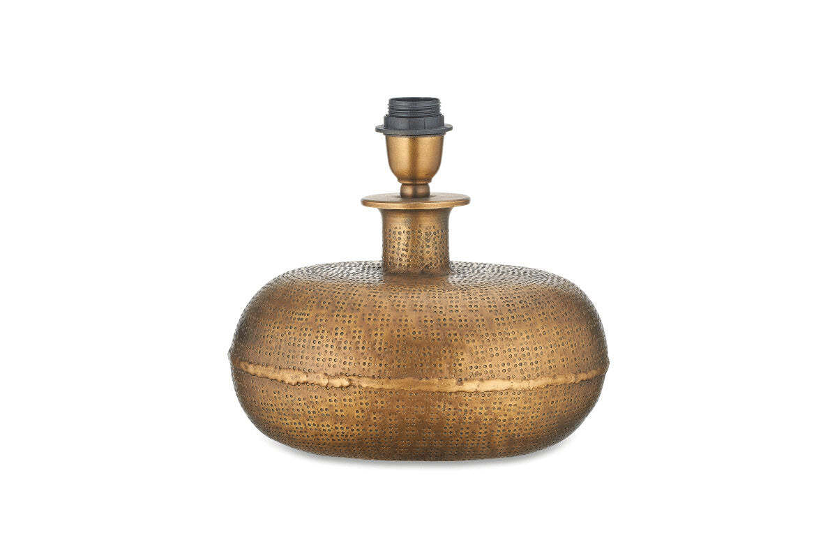 The Lumbu Lamp - Antique Brass - Small by nkuku features a rounded, textured base with a hammered finish, narrow neck, and black holder. Its dotted patterns give an antique, handcrafted look—ideal for decorative lighting against white backgrounds.