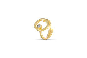 The Mari Labradorite Ring - Gold by nkuku is a hypoallergenic, gold-plated open band with an abstract, looped design and a round blue labradorite gemstone, displayed against a plain white background.