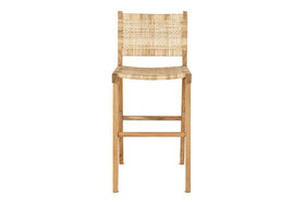 The Madrisana Acacia & Rattan Bar Stool by nkuku features a natural light acacia frame, woven rattan seat and rectangular backrest, straight legs, and a footrest bar. Its simple, modern design is shown against a white background.