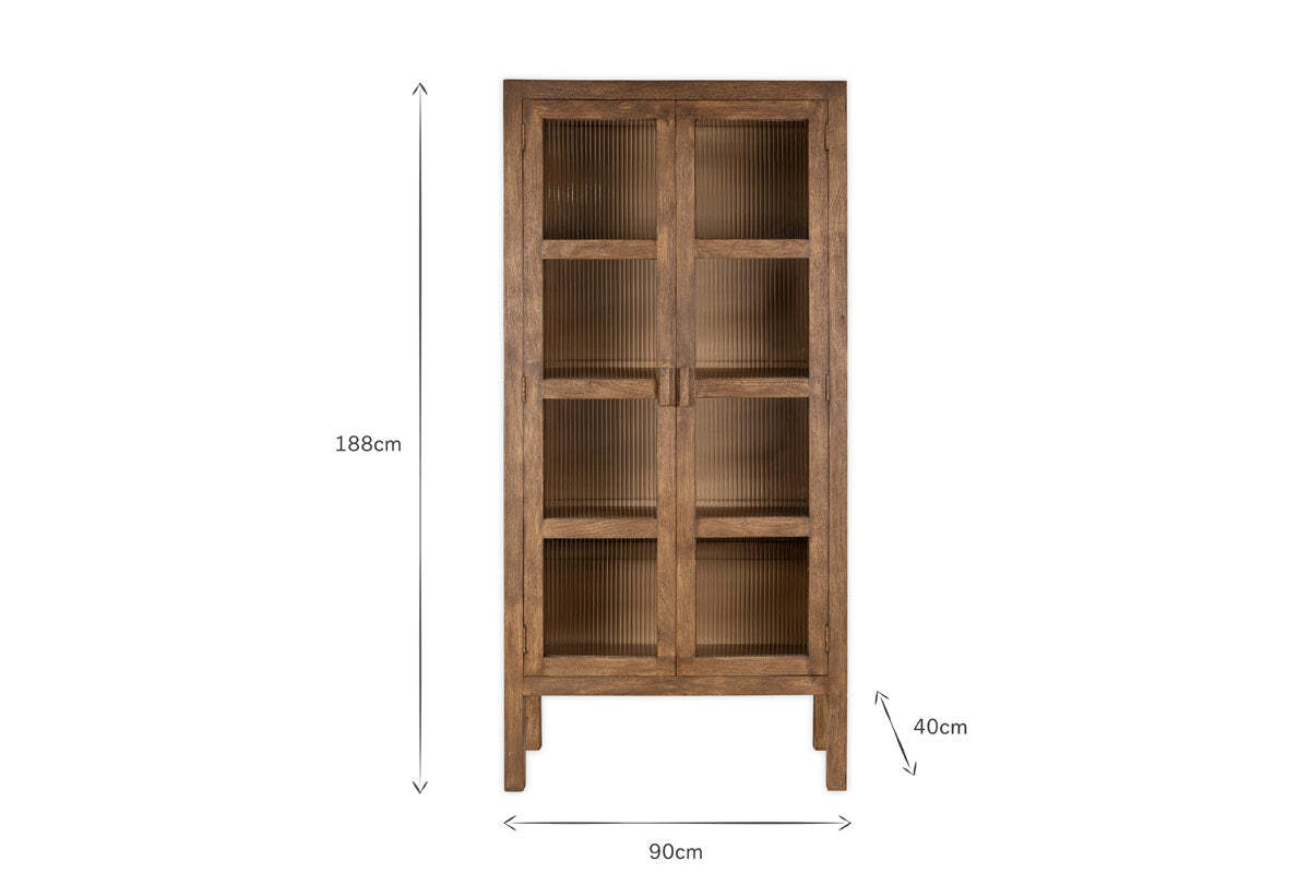 The Mendani Mango Wood & Fluted Glass Cabinet by nkuku features three shelves, fluted glass doors, vertical grooves, and stands on four legs. Finished in a walnut stain, it measures 188x90x40cm.
