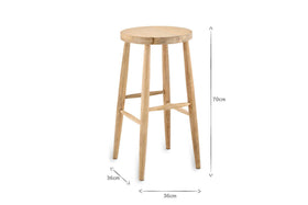 The Mengwi Mango Wood Round Bar Stool by nkuku features a natural finish, a light round top, sustainable mango wood construction, four tapered legs with footrests, and measures 70cm tall by 36cm wide.