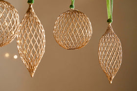 The nkuku Nirav Wire Baubles – Brass (Set of 4) are perfect for adding elegance to your Christmas décor.