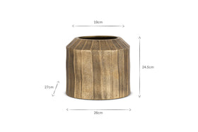 The Nabara Cast Aluminium Planter by nkuku features an antique brass finish, vertical ridged texture, and a cylindrical shape. It stands 27cm tall, 26cm wide at the base, 19cm at the opening, and is 24.5cm high to the rim.