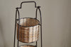The nkuku Montali Iron & Rattan Three-Tiered Storage Stand - Natural features a handwoven wire and rattan design with a sturdy metal frame, making it perfect for organizing your kitchen or pantry.