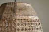 Close-up of the Shawa Rattan Lampshade - Natural by nkuku, showcasing its handwoven crisscross and lattice design. The neutral background highlights the airy texture and artisan craftsmanship of this organic lighting piece.