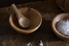 The nkuku Daruka Salt & Pepper Dipping Bowls with Spoons - Natural add charm to your table, featuring matching wooden bowls and spoons perfect for serving salt, pepper, or condiments.