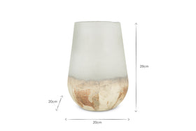 The Ngolo Recycled Glass Vase - Aged Smoke by nkuku features translucent, frosted glass with a rustic beige and brown textured base. It’s conical (29cm tall, 20cm wide at the base, 20cm base height) with a narrow top and wide bottom.