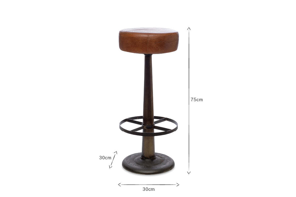 The nkuku Narwana Leather Round Stool - Aged Tan features a tall 75 cm height, a round aged tan leather seat (30 cm wide), dark tapered metal base, and 30 cm circular footrest, all centered on a white background.
