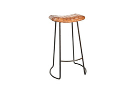The Narwana Ribbed Leather Stool - Aged Tan (Large) by nkuku features a modern ribbed leather saddle seat, slender black metal legs with footrest, and subtly curved base supports, shown against a plain white background.