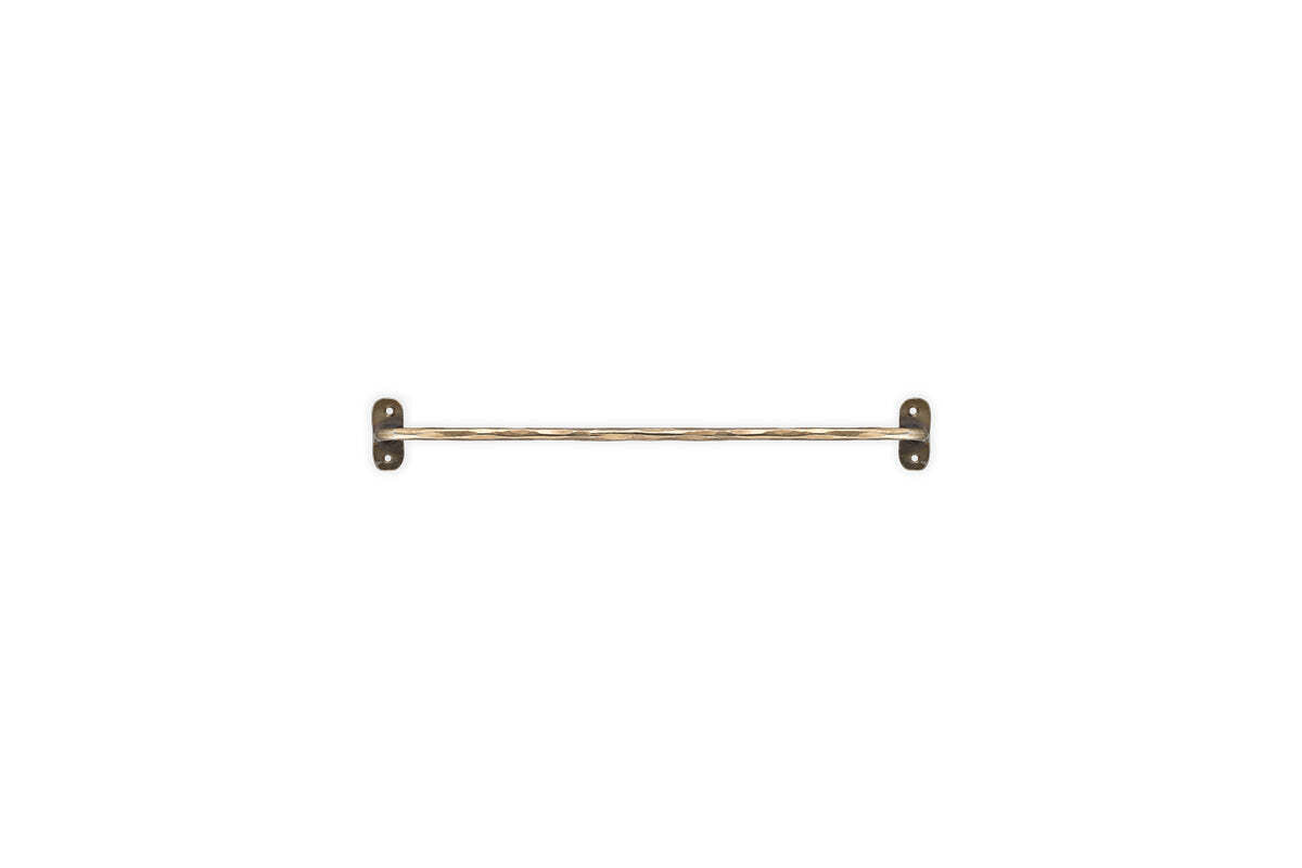 The Olani Bathroom Hanging Rail by nkuku, in antique brass, features twisted detailing and two rectangular mounting plates with visible screw holes—ideal for any bathroom. Complements stainless steel or other Olani Hanging Rail accessories.
