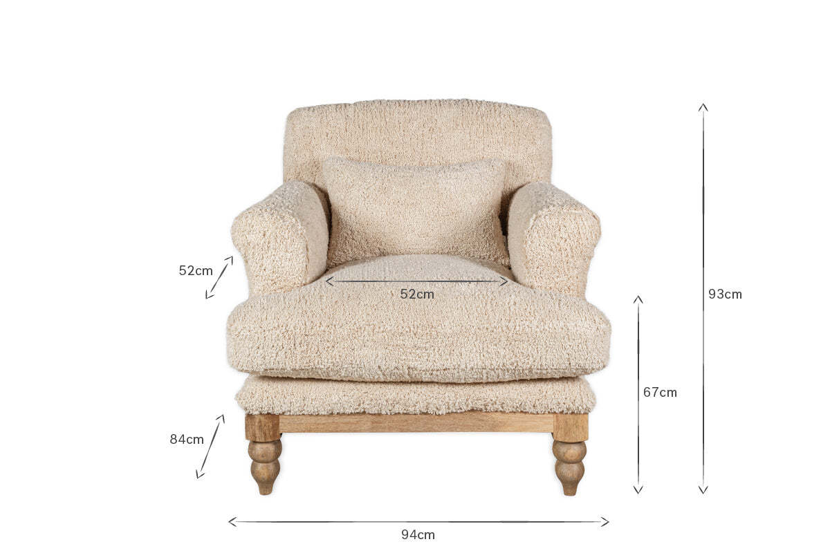 The nkuku Otas Teddy Cotton Armchair in Off White features a pillow, wooden legs, and a mango wood base. Dimensions labeled with arrows: 93cm tall, 94cm wide, 84cm deep; seat height 52cm, arm height 67cm, seat width 52cm.