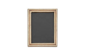 The nkuku Pambani Photo Frame features an antique brass frame and a black background.