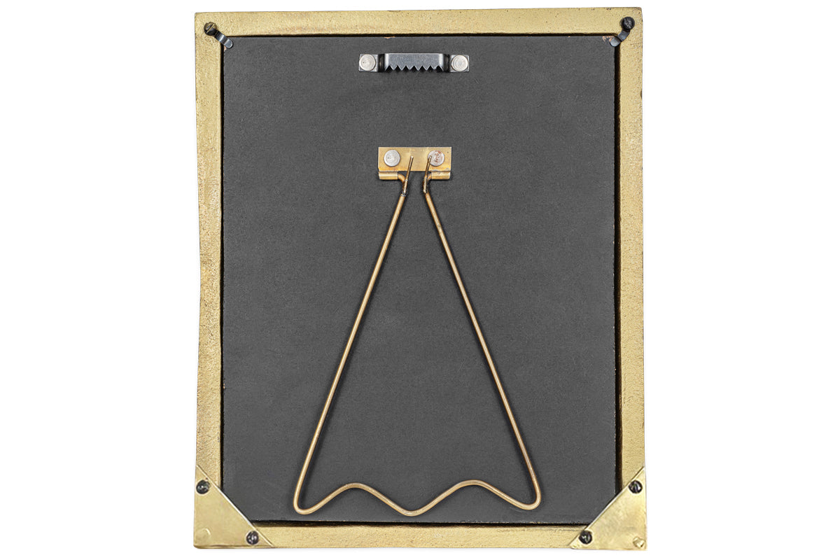 The Pambani Photo Frame - Antique Brass by nkuku features a gold-colored metal border, black backing with gold corner accents, a triangular wire stand, and a black toothed hook for wall hanging.