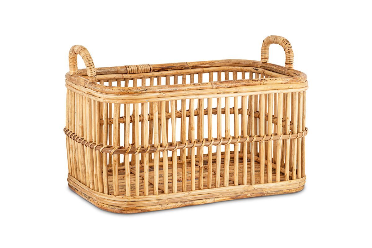 The Rammi Rattan Laundry Basket by nkuku features a rectangular design with open slats and two looped handles, crafted from natural light brown rattan. Shown empty on a plain white background.