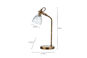 The nkuku Rarni Recycled Glass Table Lamp in Antique Brass stands 50 cm tall with a 15.5 cm round base and a 10 cm ribbed glass shade. Its diagonal arm section measures 37.9 cm. Shown on a white background.