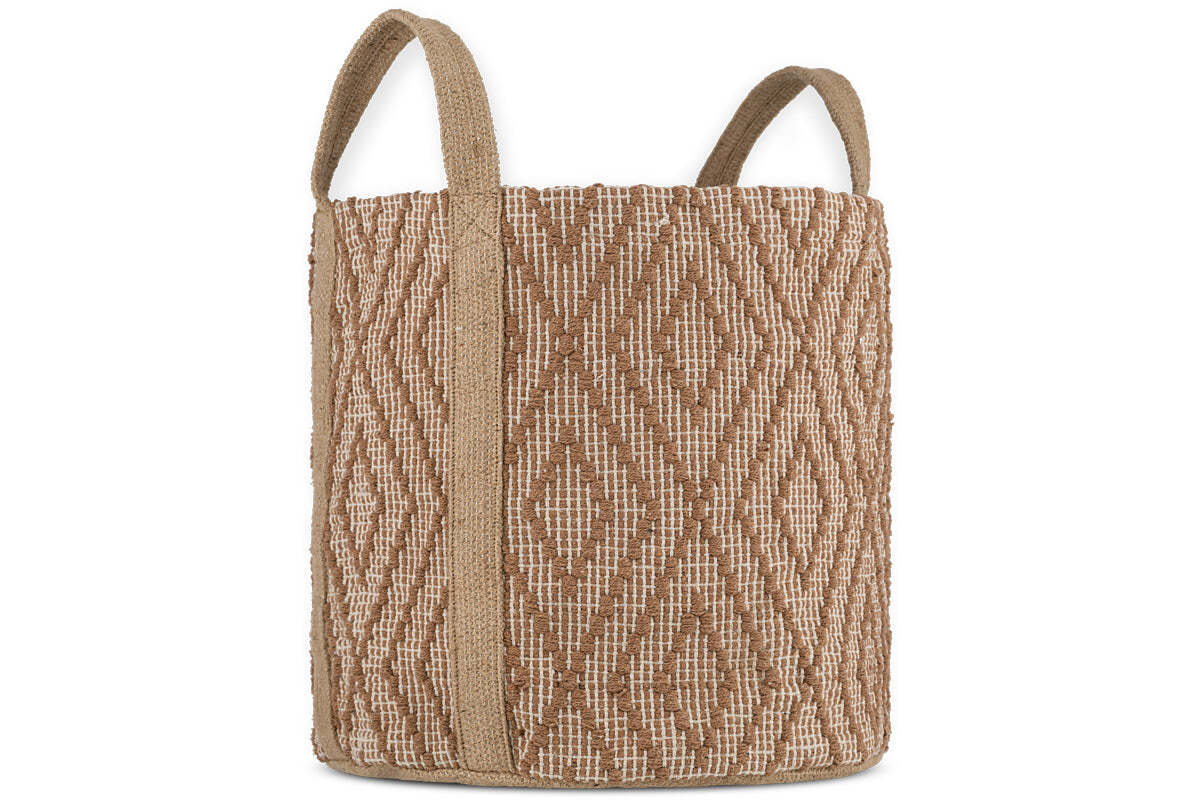 The Renu Jute Basket by nkuku is cylindrical with two handles, featuring a rust and natural geometric kilim design, vertical tan straps, and a coarse natural fiber texture.