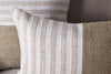 Two nkuku Samata Recycled Cushion Covers in moss, featuring textured horizontal stripes and a simple, modern design, are displayed against a beige background. Each cushion cover blends wide and narrow stripes for visual interest.