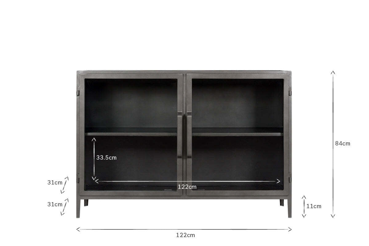 The Takua Iron Sideboard by nkuku features a black metal frame, two glass doors, and four 11cm-high legs. Measuring 122cm wide, 84cm tall, and 31cm deep, it includes two adjustable shelves (33.5cm high) for flexible kitchen storage.