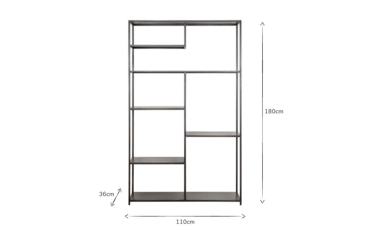 The Tanvi Display Shelf - Black - Wide by nkuku is a tall, rectangular black metal shelf with open, asymmetrical shelves. Measuring 180x110x36 cm, it offers a modern geometric look—ideal as a room divider or industrial shelving. White background.