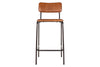 The Ukari Counter Chair - Aged Tan by nkuku features a brown leather padded seat and backrest, set on a black metal frame with four straight legs and a simple footrest. Its minimalist, modern design adds style to any space.
