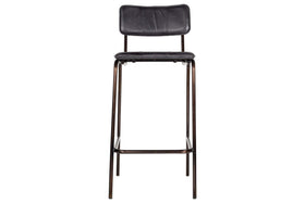 The nkuku Ukari Counter Chair - Aged Black features a curved back and rectangular seat in aged-black leather, set on a dark metal frame and legs for a modern, counter-height design.