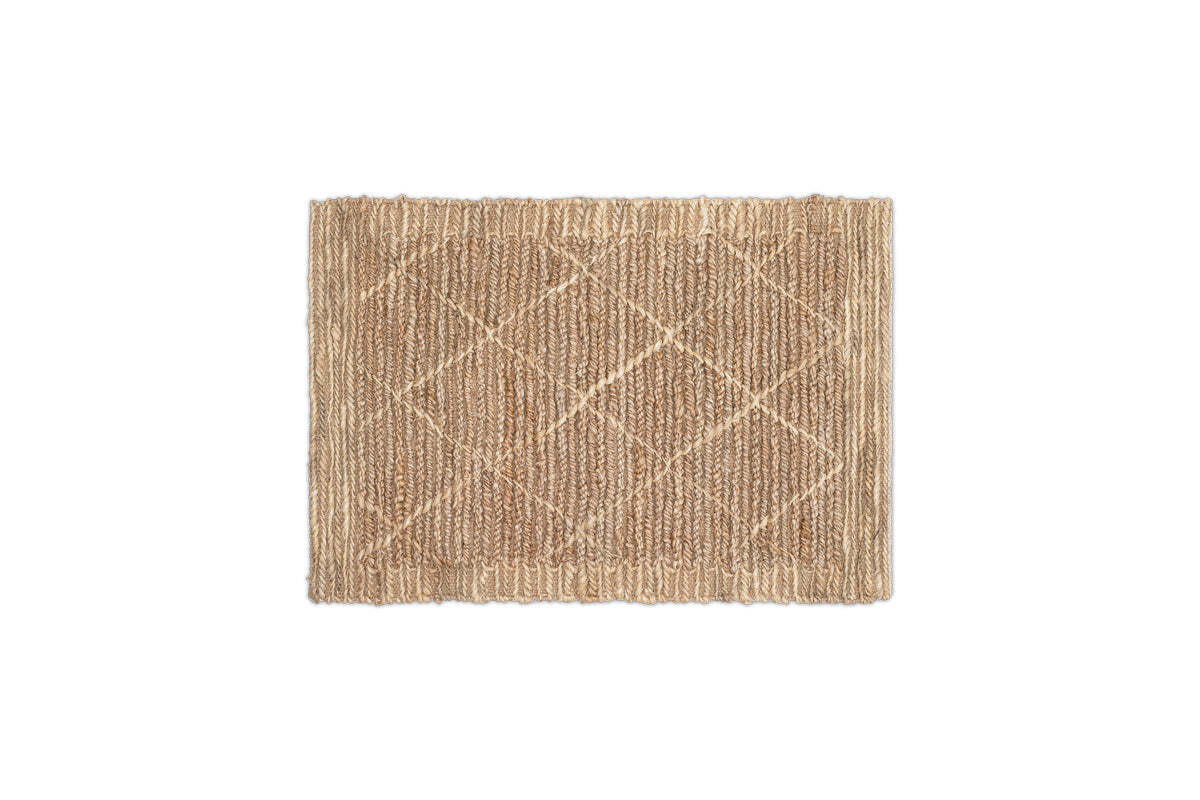 The Vandi Jute Doormat by nkuku is a rectangular, natural light-brown mat with a woven diamond pattern and slightly raised edges, displayed on a white background.