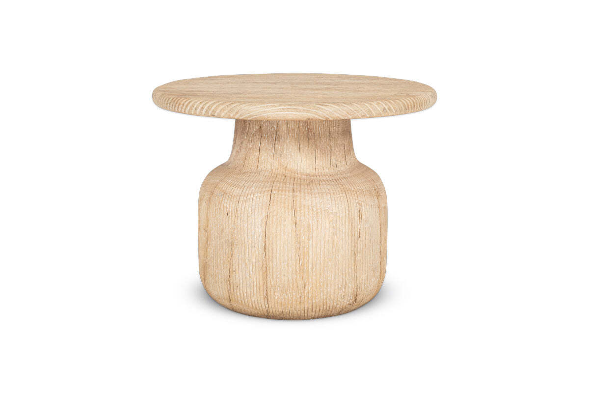The nkuku Vivan Grooved Wood Side Table is a compact, lightweight piece made from sustainable mango wood, featuring a grooved round top and cylindrical base that highlights its natural grain and minimalist design.