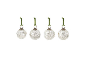 The nkuku Adoya Baubles - Aged Nickel (Set of 4) feature ribbed glass designs, each with a silver cap and green velvet tie, offering elegant festive decor against a plain white background.